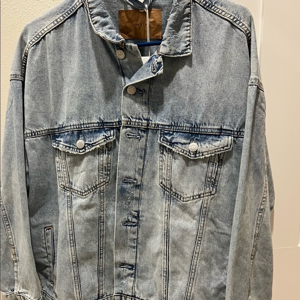 Distressed light wash jean jacket